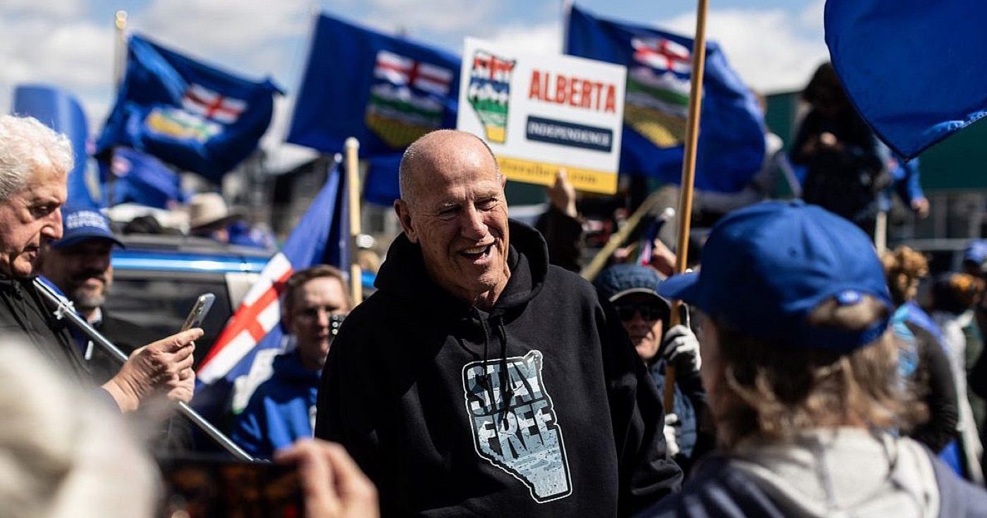 Mitch Sylvestre arriving at Elections Alberta with supporters