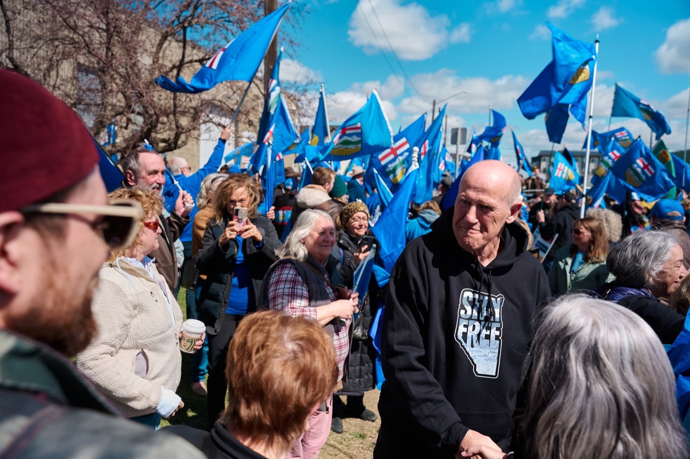 Mitch Sylvestre among supporters waving Alberta flags